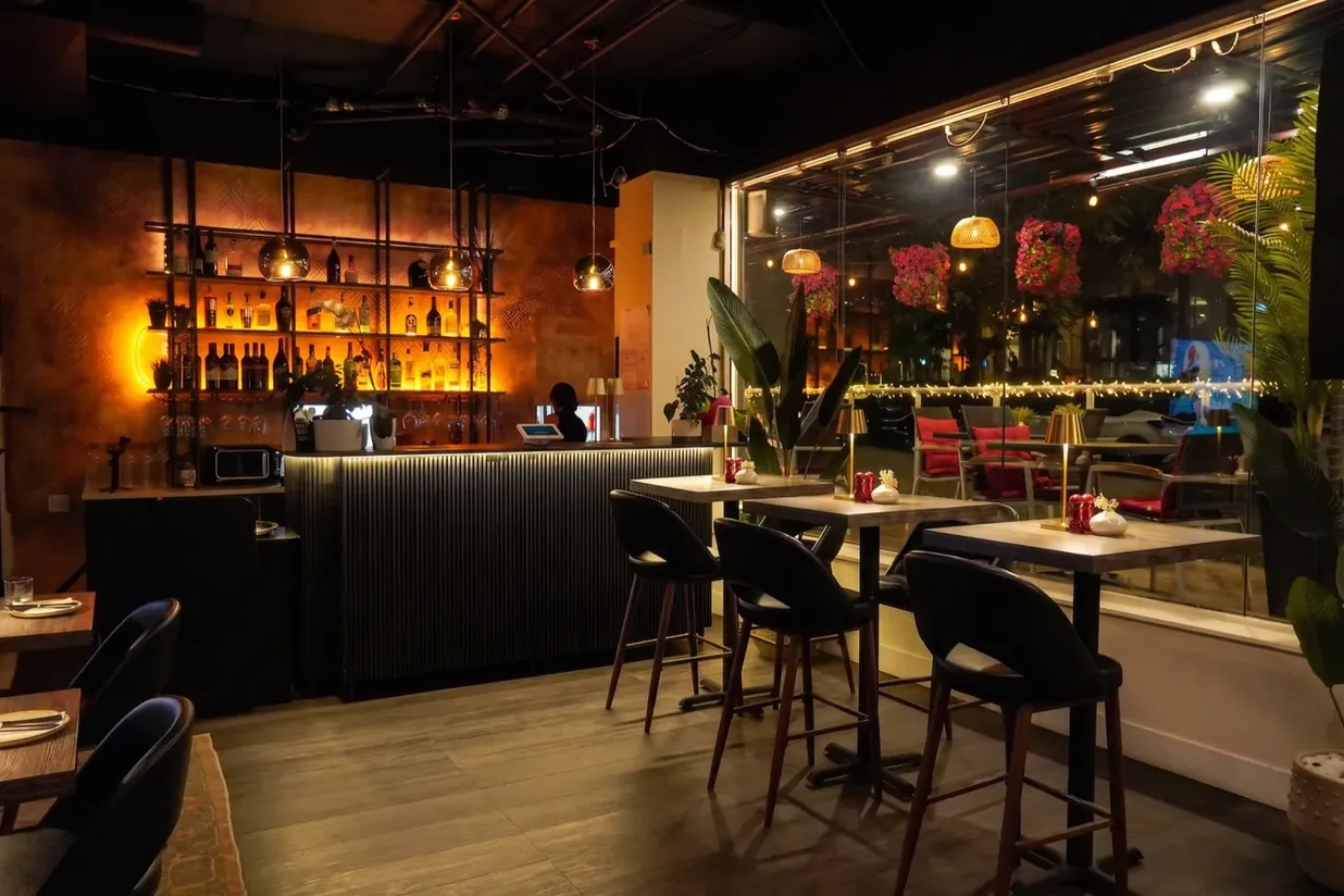 The bar at Diba, lit warm at night